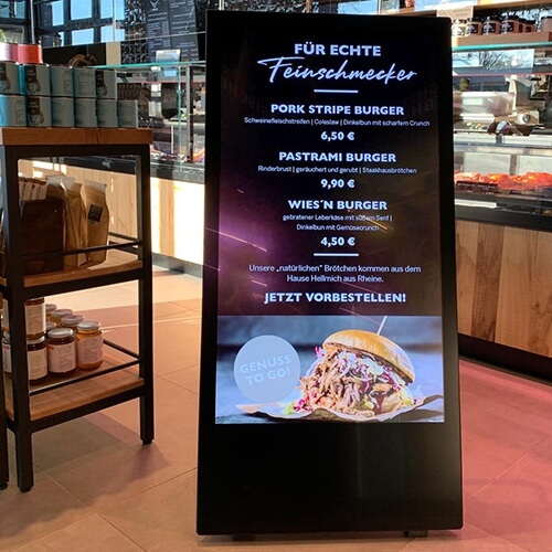 L'image représente un chevalet digital qui affiche le menu de ce restaurant de burger
